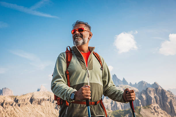 istock Mature man with backpack hiking at Dolomite 2223189690