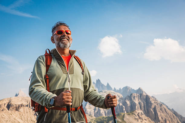 istock Mature man with backpack hiking at Dolomite 2223189699