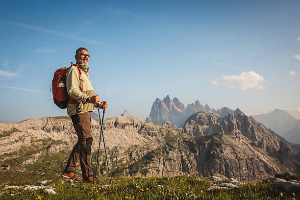 istock Mature man with backpack hiking at Dolomite 2223189760
