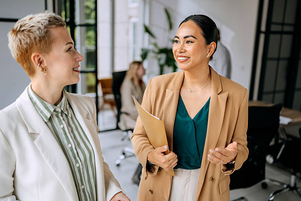 istock Two businesswomen engaged in a discussion at a modern office 2223190630