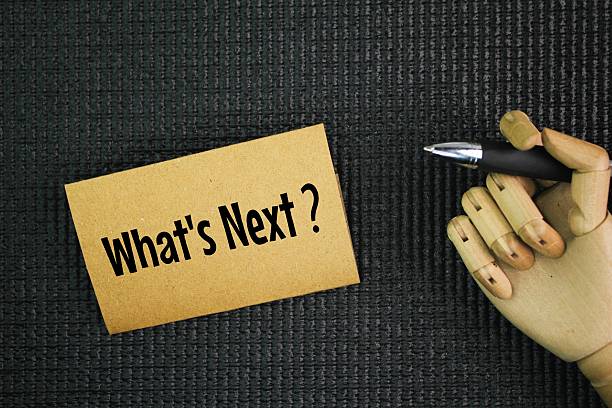 istock Pen and paper with word question What's Next? next step concept. coming immediately after the time of writing or speaking. 2223192281