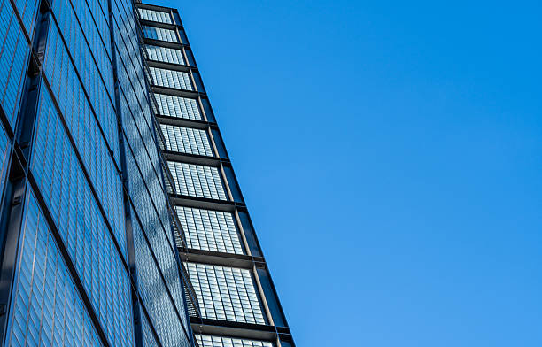 Germany, Berlin, Central Berlin, February 20, 2025 - A tower made of glass bricks against a clear sky