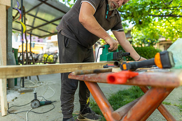 istock Man working on carpentry project outdoors with saw, Tool organization and backyard DIY lifestyle 2223193741