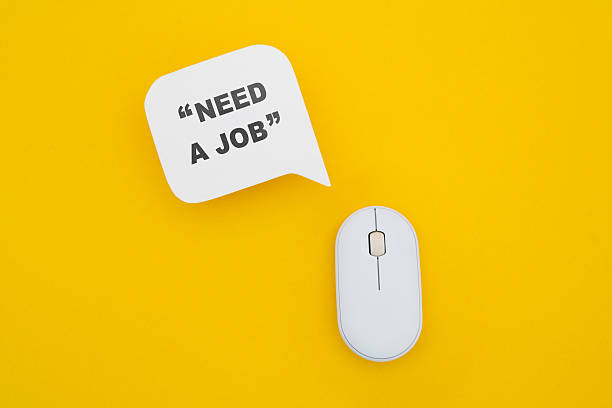 istock real white speech bubble paper cut with NEED A JOB in quotation marks and computer mouse on yellow background 2223193886