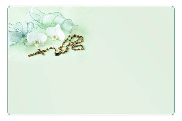 Phalaenopsis and rosary with pale green background.