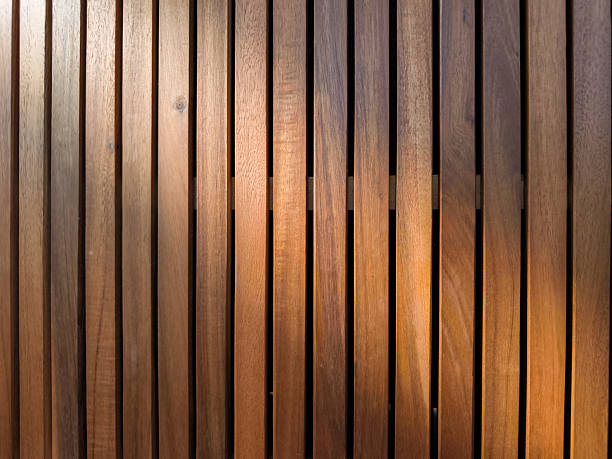 istock Sunlight filtering through wooden slats creates dramatic shadows copy space 2223198180