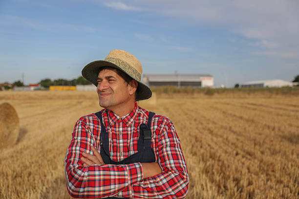 istock Confident Farmer Standing Proudly in Wheat Field 2223201046