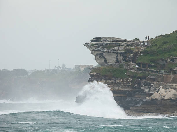 Waves crash into a headland south of Bondi Beach during a weather event known as a \