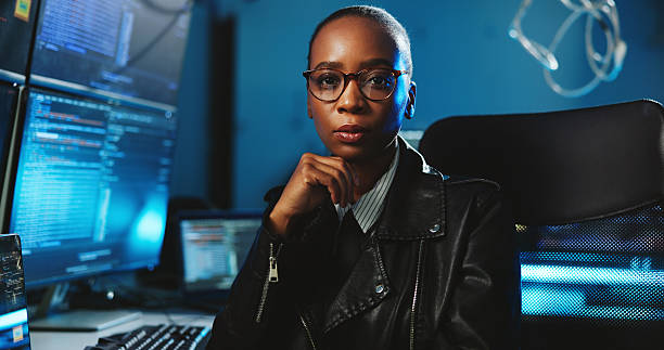 istock Portrait, black woman and coding on computer at night for programming, cyber attack and online information. Person, pc and research for website phishing, data protection and server script for hacking 2223208551