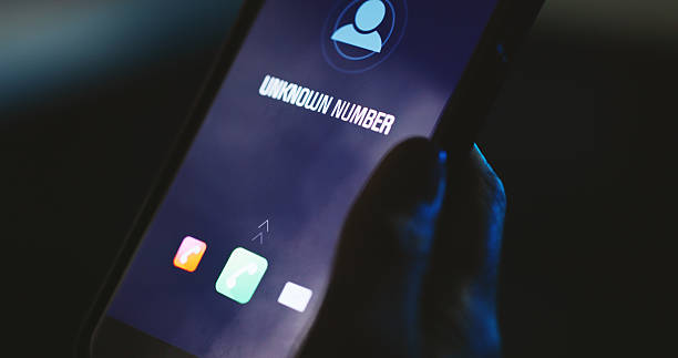 istock Phone call, screen or hand with unknown number, alert or icon display for phishing scam contact at night. Person, dark and hacker with digital graphic, mobile user and tech for incoming anonymous ID 2223208564