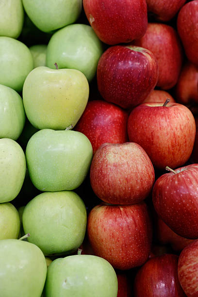 Colorful Contrast: Crisp Red and Green Apples Together Stock Photo