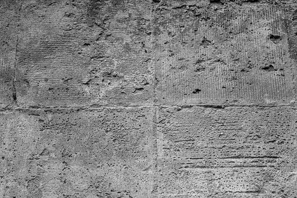 Textured concrete wall with pitting for concept of architectural surface detail