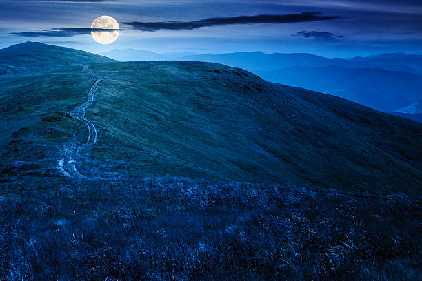 istock scenic mountain landscape with hill at night 2223212379