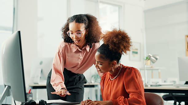 istock Document, mentor and business women in training, help or advice for copywriting in creative startup office. Team manager, coaching intern and learning content writing, talking or teaching on computer 2223215057
