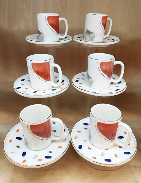 istock Coffee cups and saucers with a beautiful decorative pattern on the shop window 2223216370
