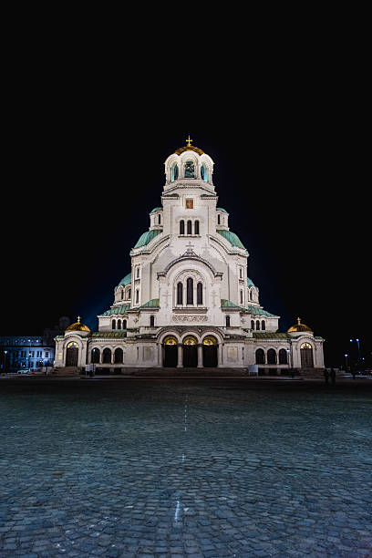 istock Illuminated Alexander Nevsky Cathedral in Sofia, Bulgaria at Night with Dark Sky and Cobblestone Foreground 2223217041