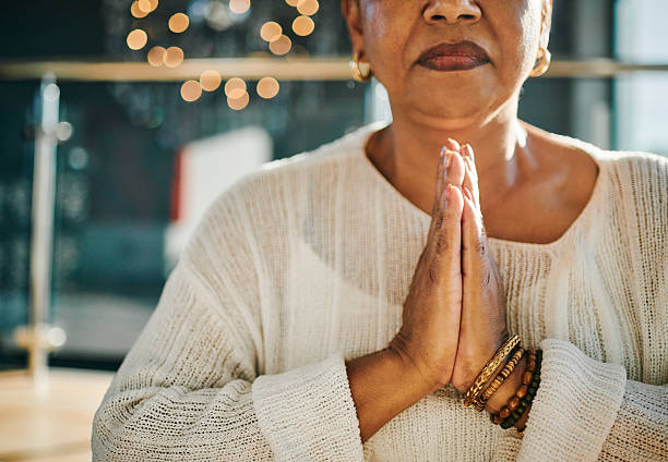 istock Peaceful Moment of Prayer in Sunlight 2223217285