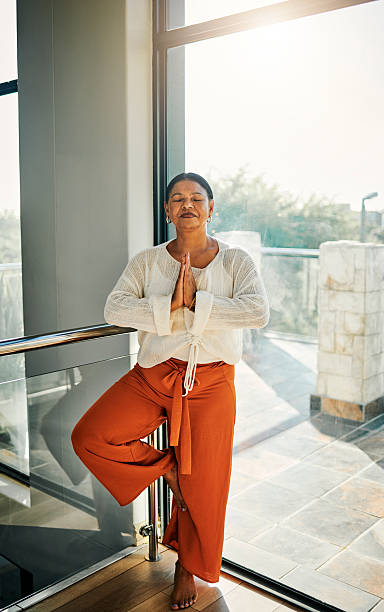 istock Serene Woman Practicing Yoga in Natural Light 2223217302