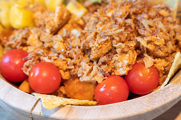 istock Savor tender pulled chicken with cherry tomatoes and crispy tortilla chips for any occasion 2223217440