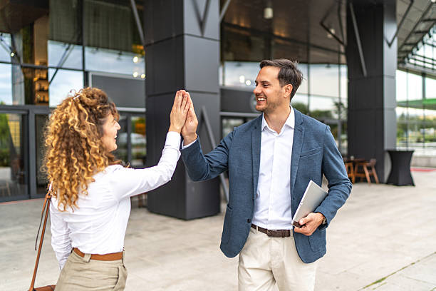 istock Business people giving high five outdoors after successful meeting 2223220229