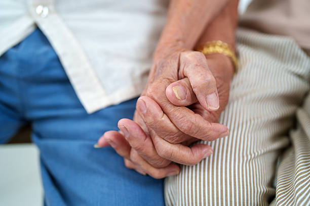 istock Senior Couple Holding Hands in a Tender Moment 2223220691