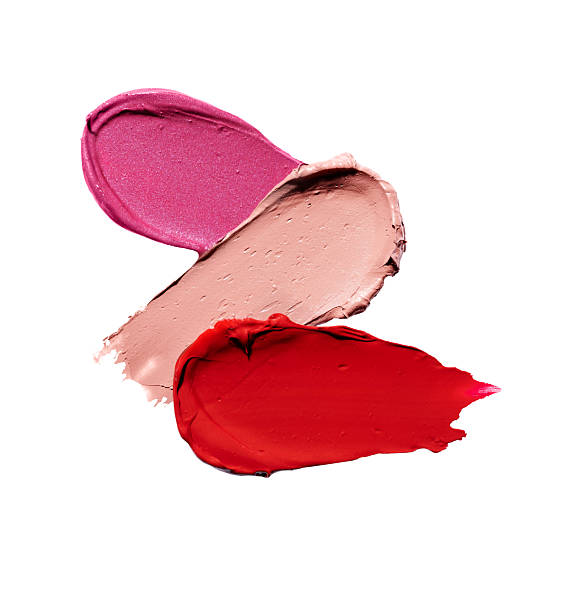 istock Composition with lipstick swatch isolated on white background. Pink, red and brown lipstick smear smudged showcasing lipstick texture. 2223222312