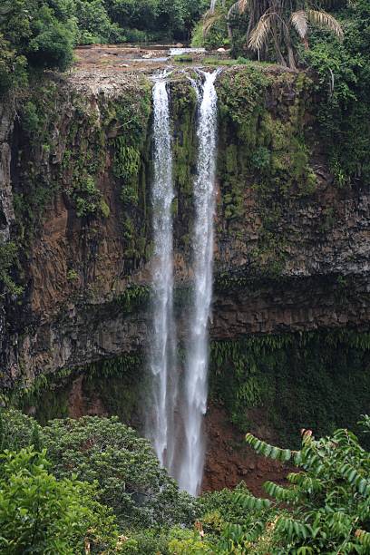 istock Majestic waterfall amidst tropical greenery 2223223528