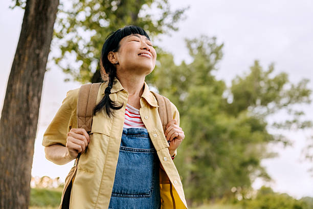 istock Smiling woman enjoying day in nature 2223223566