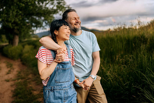 istock Casually clothed mature couple bonding outdoors in nature 2223223596