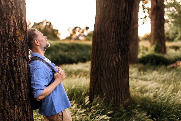 istock Side view of mature man relaxing in nature 2223224007
