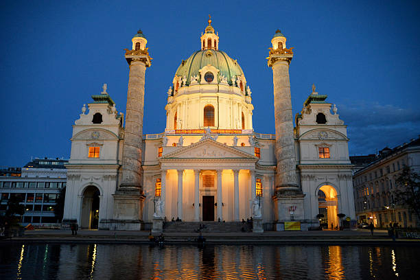 Vienna, Austria - 10 May 2019: Karlskirche Baroque Cathedral with Night Lighting