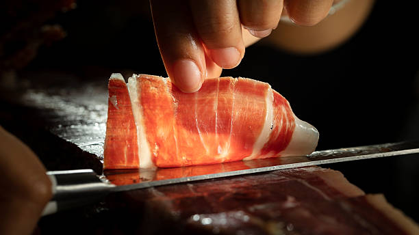 istock Iberian ham knife cutter on a black background 2223225781