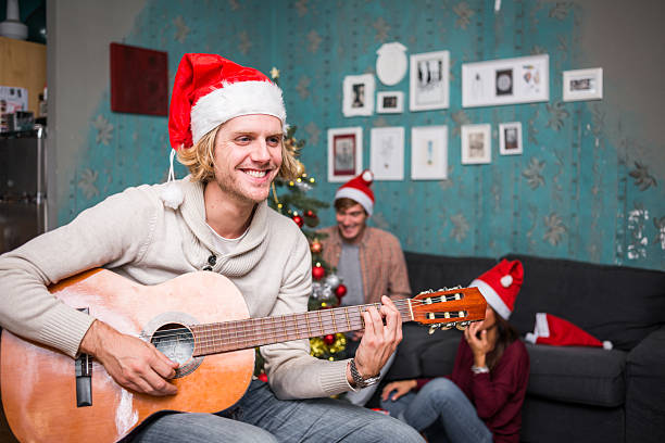 istock Friends celebrating Christmas: Giving presents 2223228651