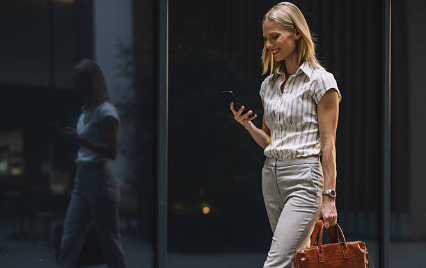 istock Modern Woman Navigating City with Phone 2223228926