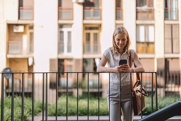 istock Young Professional Engaging with Phone in Green Space 2223229382