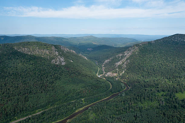 istock River flowing through forested valley in the Ural Mountains 2223231256