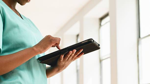 istock Medical Professional Using a Digital Tablet in a Bright Clinical Environment 2223231367