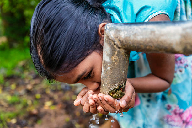istock Sri Lankan young girl drinking a water, Ceylon 2223231461