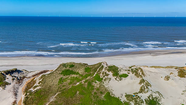 istock Coastal tranquility with soft waves and pristine sand dunes in Denmarks serene landscape 2223235672