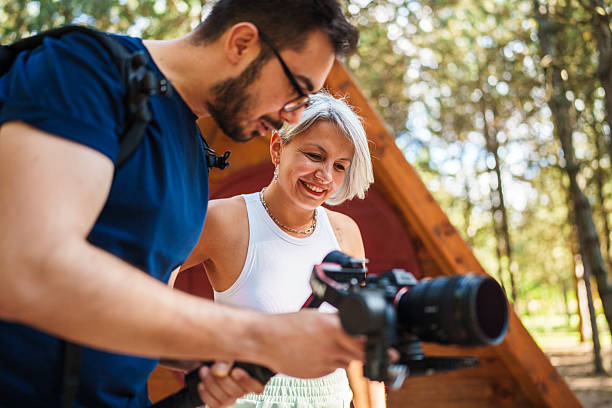 istock Behind the Scenes: Cameraman and Model in Nature 2223236970