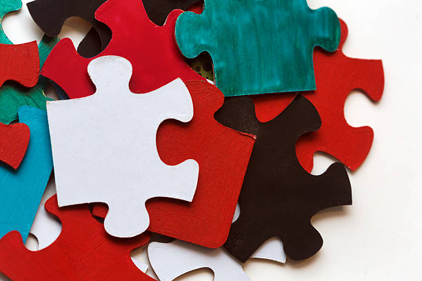 Assortment of single-color jigsaw puzzle pieces.