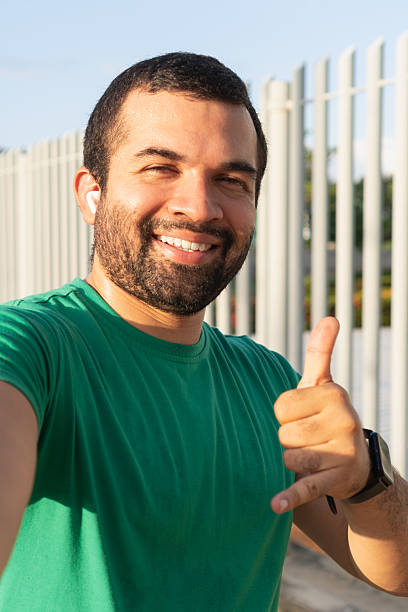 istock Happy man taking a selfie after workout showing thumbs up 2223238989