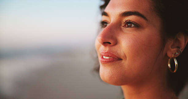istock Sunset, thinking and beach with woman, vacation and nature with memory, reflection and wonder. Ocean, summer holiday and happy person with tropical island, decision or choice with peace or travelling 2223240364