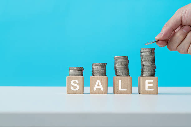 istock Stack of coins on word sale 2223241974