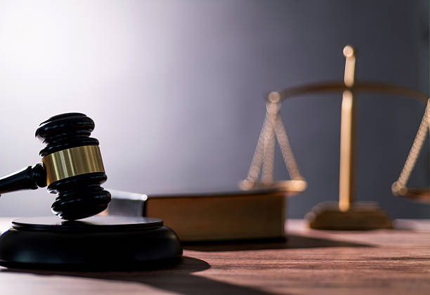 istock Gavel and scales of justice on the table 2223242004