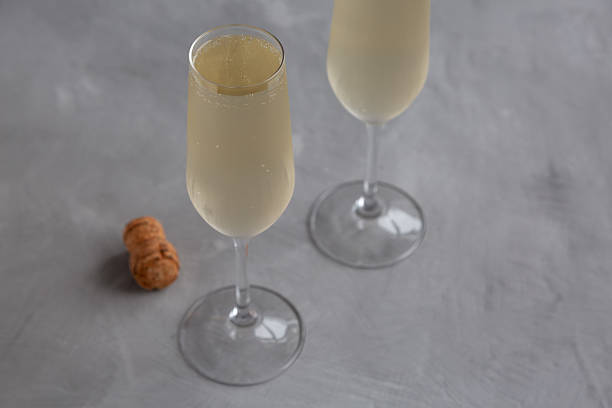 istock Cold Bubbly Champagne in a Glass on a gray background, side view. 2223242082
