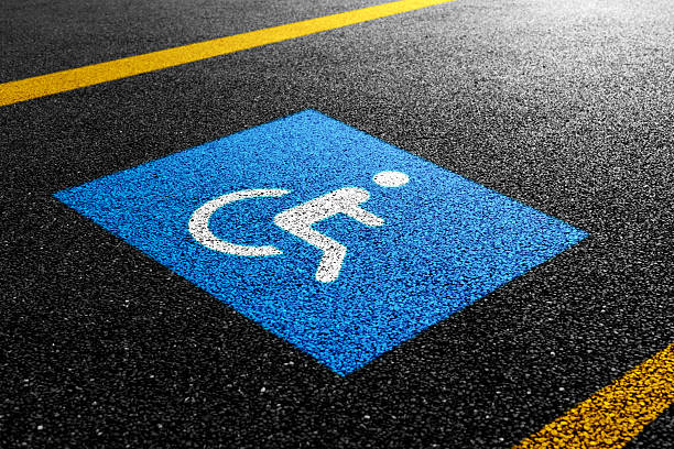 Handicap parking symbol on asphalt road