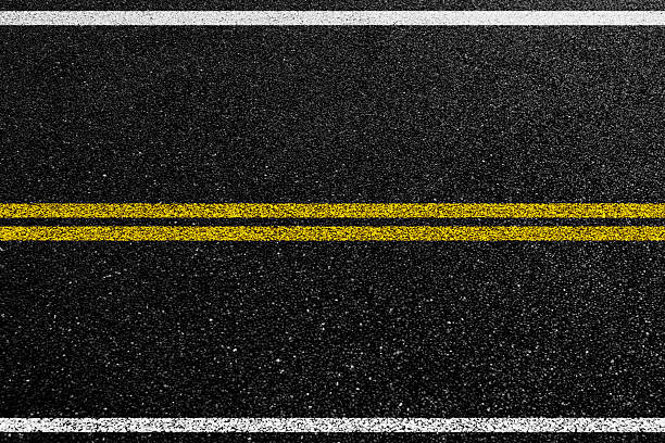 istock Double yellow line on asphalt road 2223242490