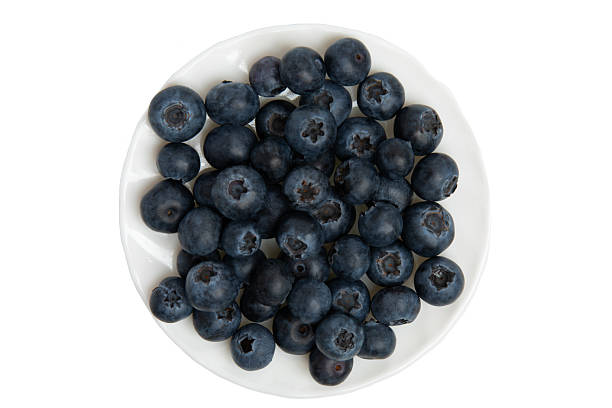 istock Dark blue ripe blueberries in a white ceramic bowl. 2223243176
