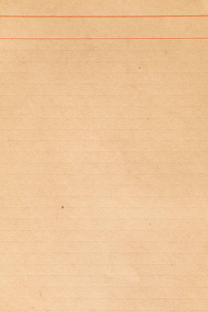 istock Old weathered yellowed note paper texture with red lines 2223246623
